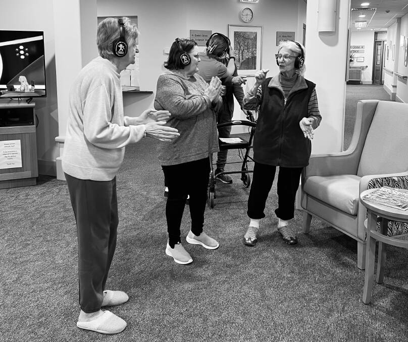 Residents don their headphones and bop away. Picture supplied