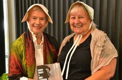 Beryl Waters and Lis Hannelly in colonial dress with new book Rowdy Voices & Quiet Whispers. 