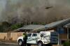 A bushfire burnt close to houses on March 6, 2024 at Castlemain Road, Ravenswood in Tasmania. Picture by Phillip Biggs