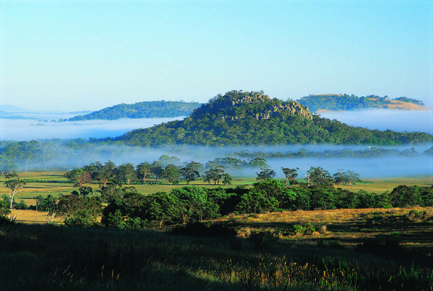 FAMED CRATER – Tower Hill rises dramatically out of the plains in a moat of mist.