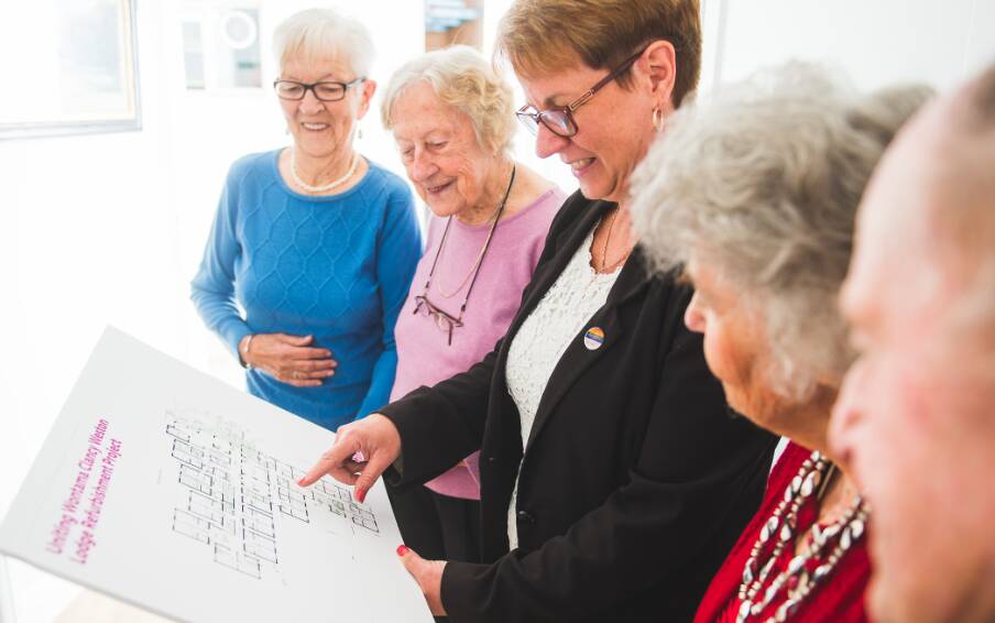 ALL IN IT TOGETHER – Helen Mobbs (centre) looks  at plans with Wontama residents Rita Vanderby, Betty Kinsey, Joan Davis and Derek Parkes.