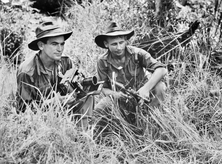 Australians shelter from Japanese snipers in Borneo, 1945. Australian War Memorial collection/Flickr Fiona Ross, University of Melbourne