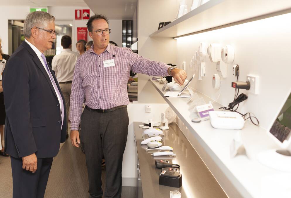 WONDER WALL – Minister for Aged Care Ken Wyatt (left) with Feros Care technology specialist Andrew Bacon at the opening of the new Experience Centre.