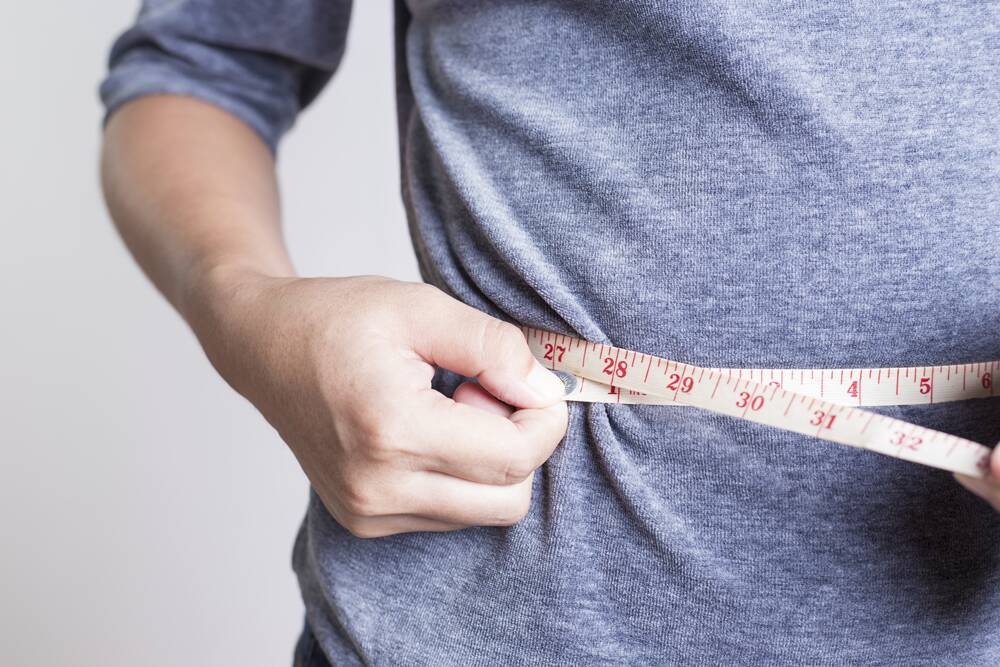 Losing just a few kilograms could make a big difference to the health cost of obesity. Photo: iStock