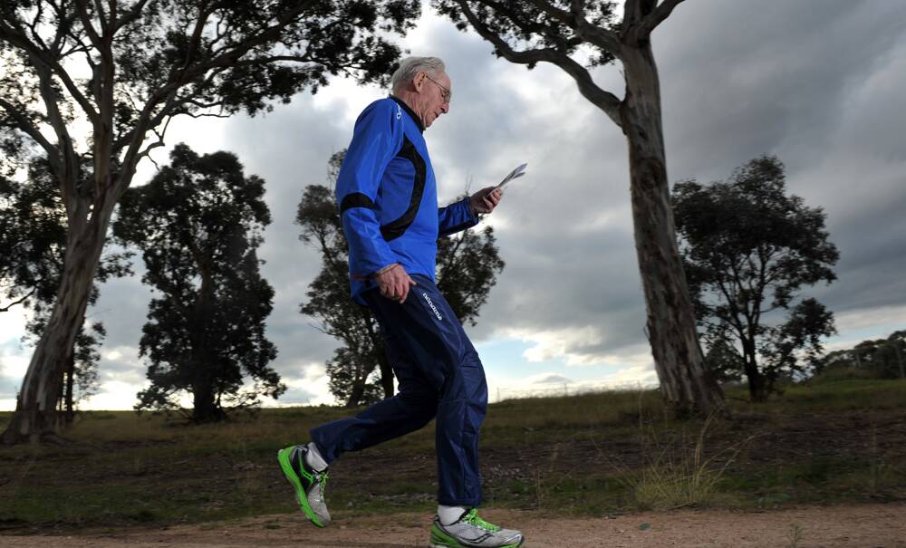 ON COURSE – Orienteering giant Hermann Wehner (pictured here  at 90) is still competing. Photo: The Canberra Times/Graham Tidy.