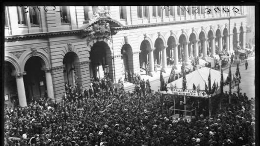 Before the cenotaph to remember those who lost their lives in World War 1 was erected in Sydney's Martin Place, the site outside the GPO was the site of a recruiting booth to enlist service men. Today it is the site of the Anzac Day Dawn service. This photo shows chief Secretary Mr Black addressing a recruiting meeting Martin Place Sydney in 1915. Photo: State Archives and Records NSW