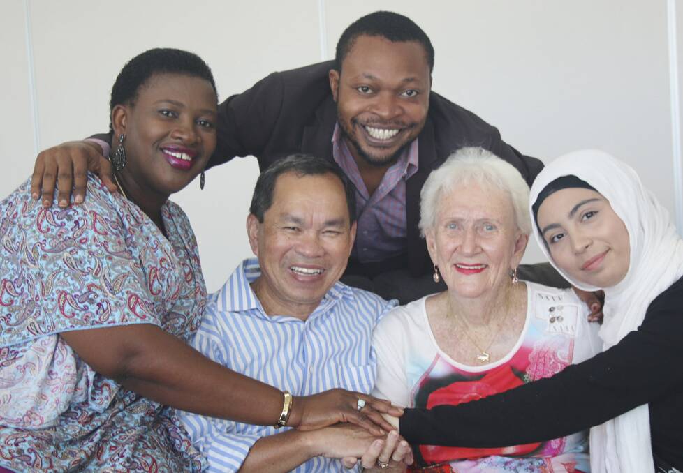 YOU’RE WELCOME – Noeline Clamp (second from right) has provided sanctuary to hundreds of refugees and migrants, say just some of her multicultural family (from left) Juliet Greene (Sierra Leone), Sophal Su (Cambodia), Blaise Itabelo (Congo) and Iman Mohit (Iran).