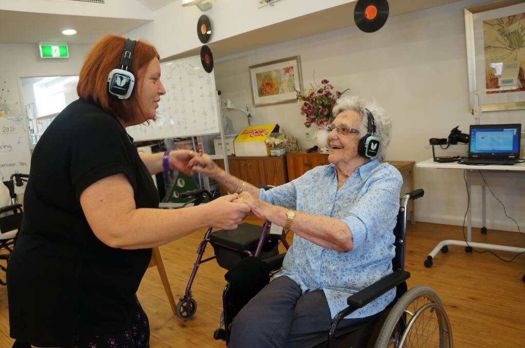 MOVED BY THE MUSIC – Sandra from Baptistcare Gracewood enjoys a moment with Adriana.
