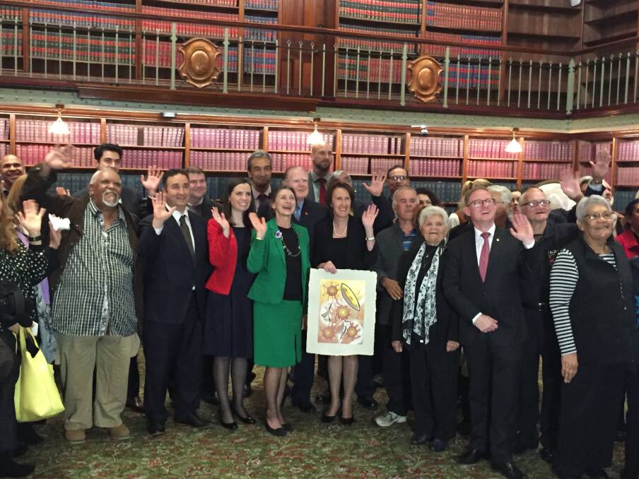 Members of the Stolen Generations mark the release of the parliamentary inquiry report