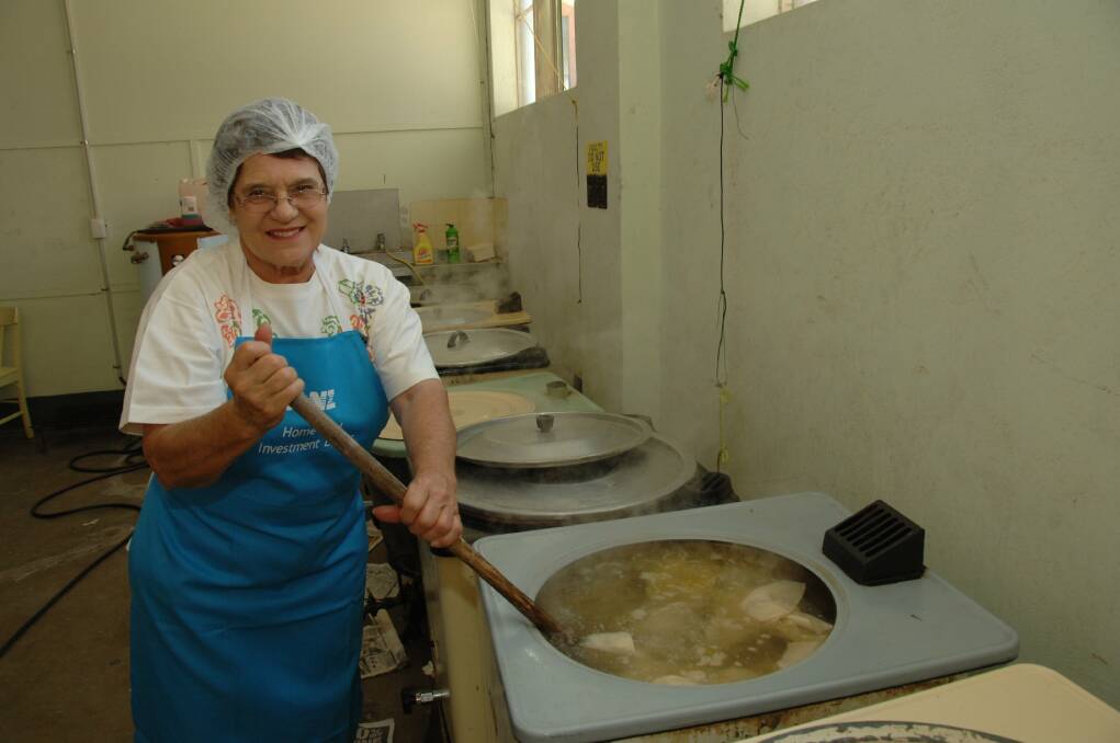 MAGIC PUDDING - Broken Hill Women's Auxiliary president Coral Ford stirs the pot. Photo: Gavin Schmidt