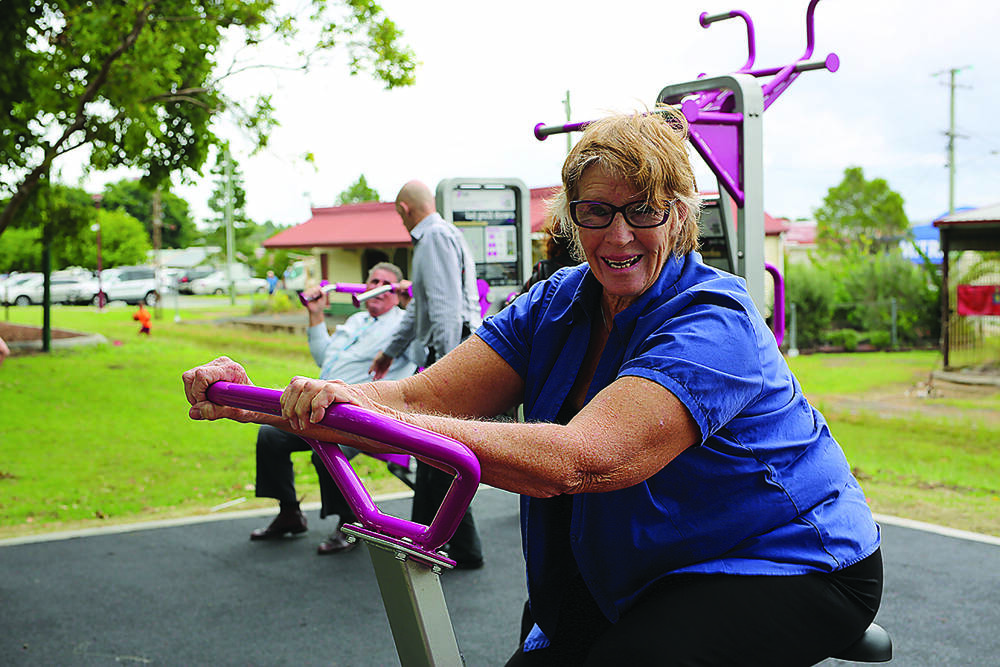 GOOD FOR THE COMMUNITY – Bev Lynch tries out the free outdoor gym.