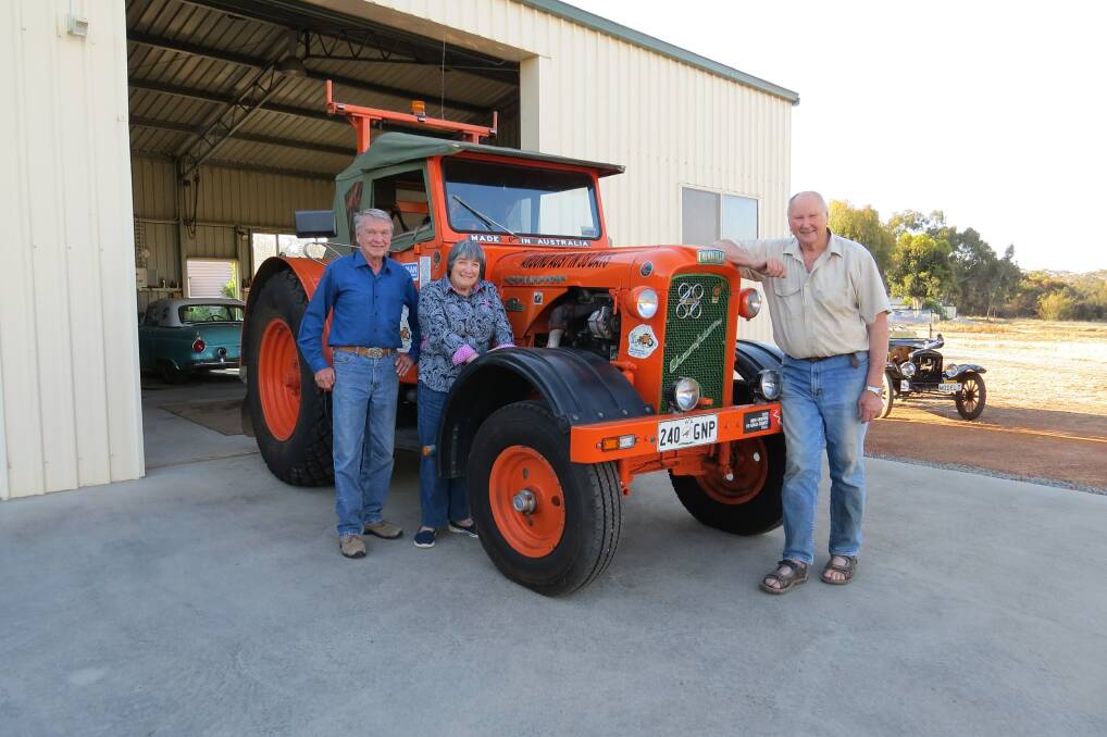 ALL SYSTEMS GO – Dick Garnett (left) and his wife Barbara give the tractor the once-over with Ron Bywaters.