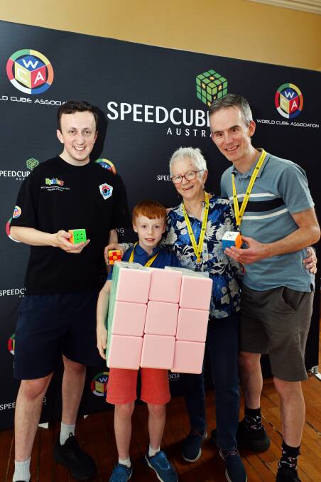 The Lewis family with Ballarat speed cuber Aaron Spiller. Picture by Kate Healy