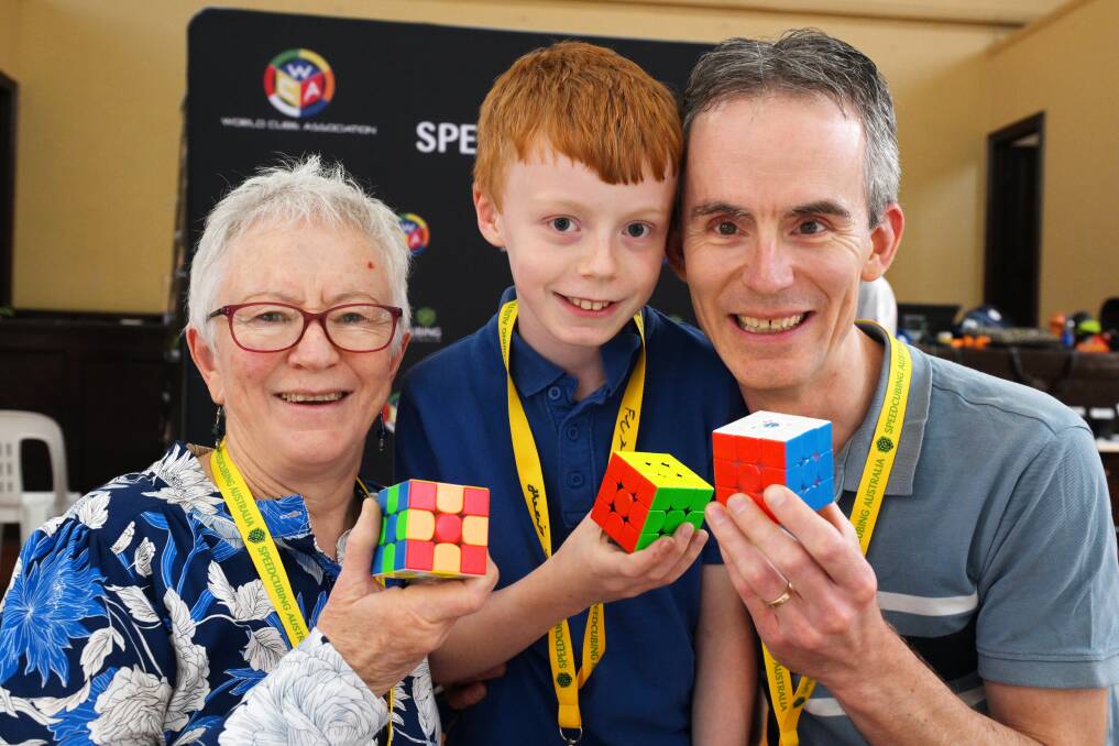 Shirley Lewis, Daniel Lewis, 10, and Michael Lewis at a speed cubing event in Ballarat. Picture by Kate Healy
