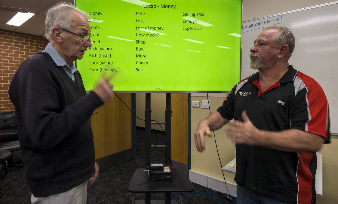 Daniel Ford and TAFE NSW Auslan teacher Robert Leeson. Picture by Daniel Ford