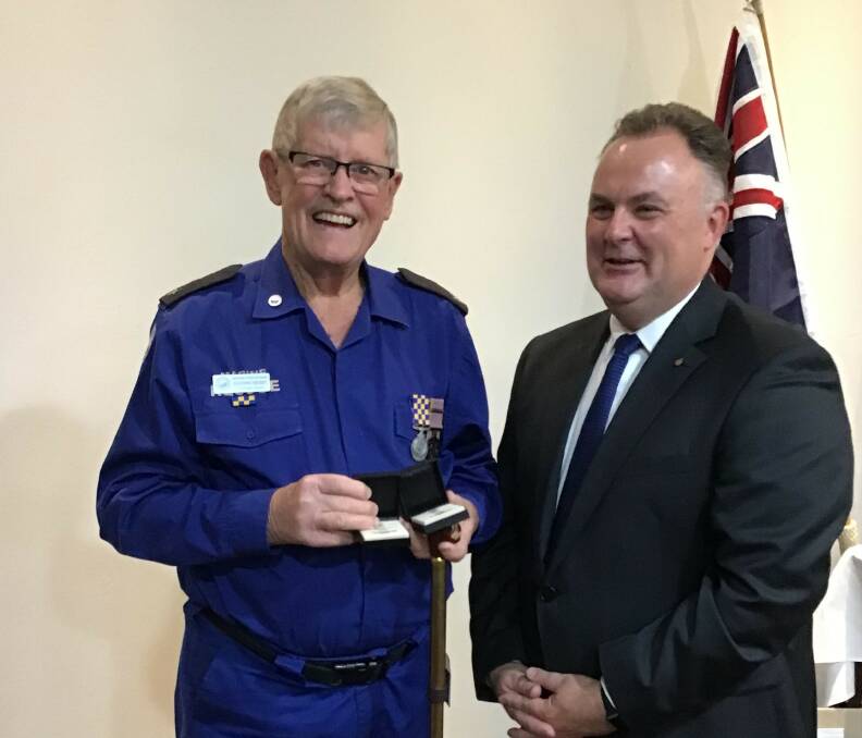 HONOURED: Sherwin Hensby, with Terrigal State Liberal MP Adam Crouch, has volunteered with Marine Rescue and other Central Coast emergency services for more than 45 years.