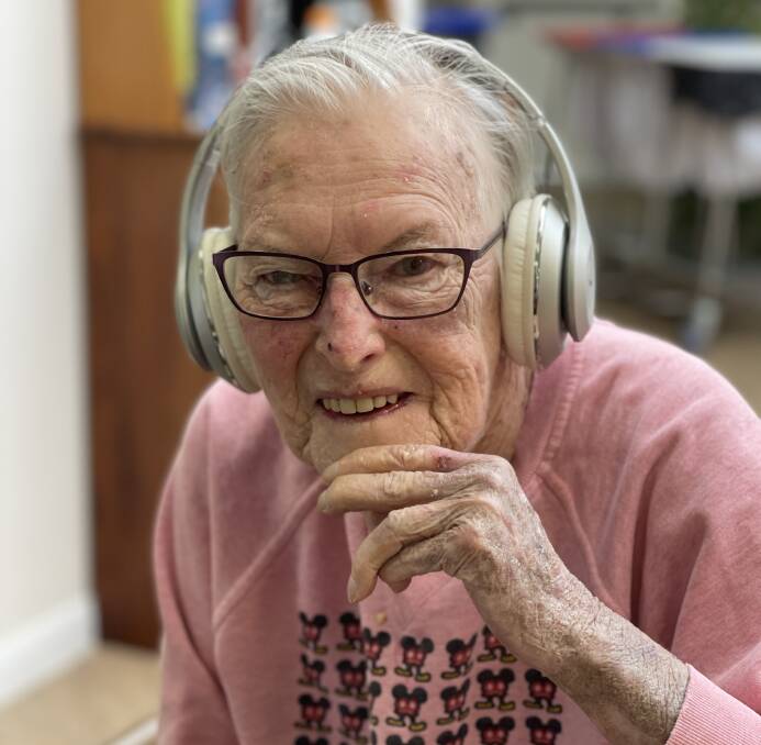 BOPPING AWAY: Residents love listening to their favourite music with their new headphones.