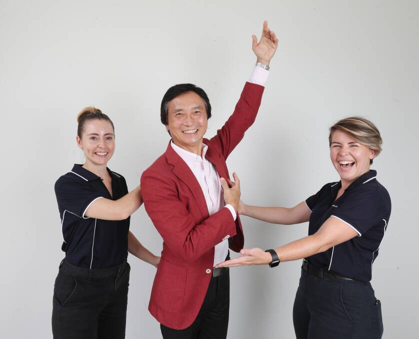 STEPPING OUT: Mater's Melissa Taylor and Asleigh Partis with Li Cunxin.