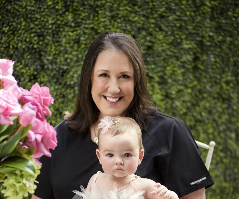 Dr Vicki Nott from Burmeister's clinic with baby Storm, who was created using IVF