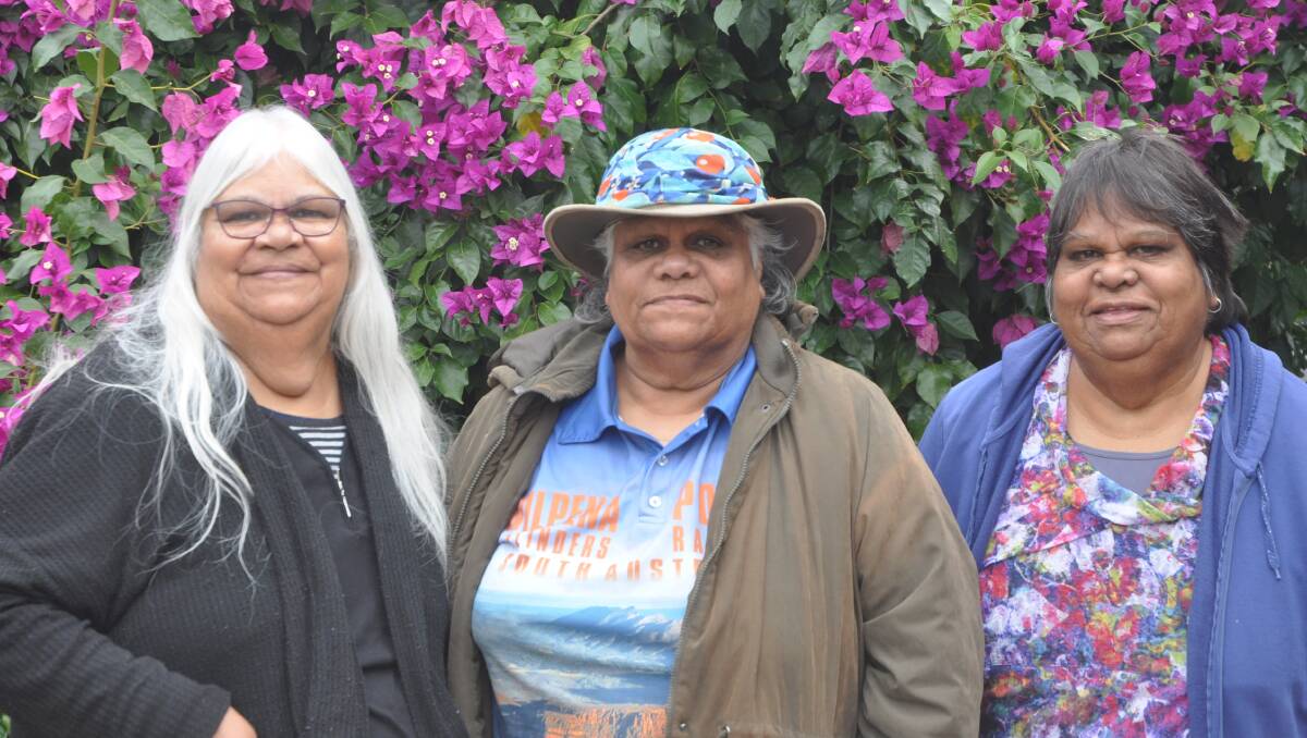Sisters Cynthia Webster, left, Noeleen Ryan-Lester and Denise Champion were overjoyed to have their great uncle David Ryan's art returned. Picture: Aidan Curtis.