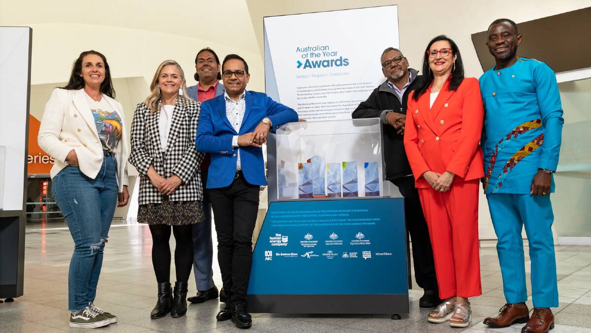 2023 Australian of the Year state and territory recipients Olympia Yarger, Taryn Brumfitt, William Barton, Dr Angraj Khillian, Samuel Bush Blanasi, Professor Samar Aoun and John Kamara in front of a showcase at the official exhibition launch. Picture from NMA/Salty Dingo