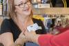 A shop assistant accepting a customer's SA Seniors Card. Picture by SA Govt