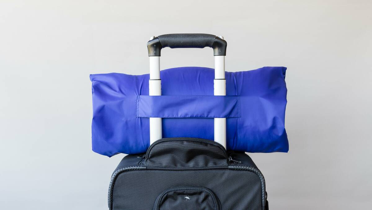 EASY TRANSPORTATION: Slip your SleepKeeper over the handle of your suitcase. Photo supplied. 