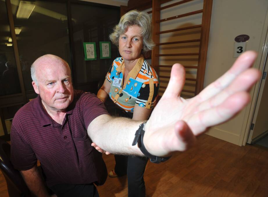 Pictured is Bill Robertson receiving physio training for Parkinson's Disease with Merrin Moran of the Forrest Centre Aged Care Service. ACM file picture