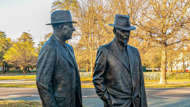 The Canberra statue of Ben Chifley and John Curtin. Photo courtesy Shutterstock. 