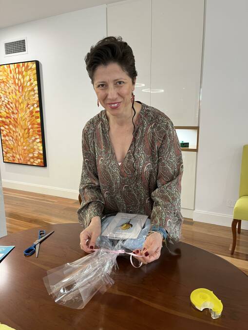 Zonta Club of Adelaide Torrens's Ozlem Yeni packing a breast cushion. Picture supplied