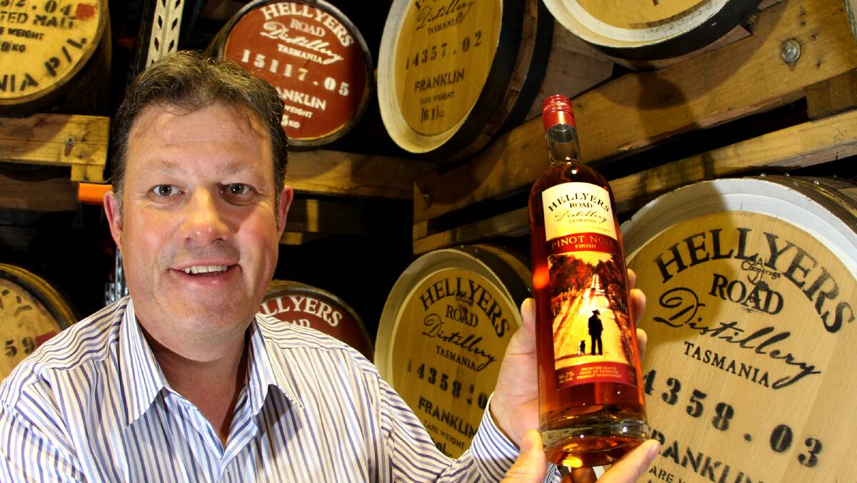 Burnie's Hellyers Road Distillery and it's award winning Pinot Noir Finish single malt whiskey master distiller, Mark Littler with a bottle of the award winning whiskey in 2015. File picture