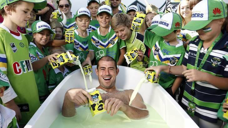 Then Canberra Raiders captain Terry Campese (above) bathes in Canberra Milk Raiders Lime in 2013. Picture: Jeffrey Chan