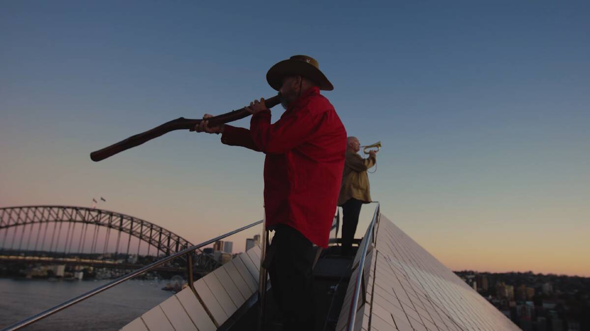 Mark Atkins and James Morrison perform The Last Post on top of the Sydney Opera House. Picture by Garuwa