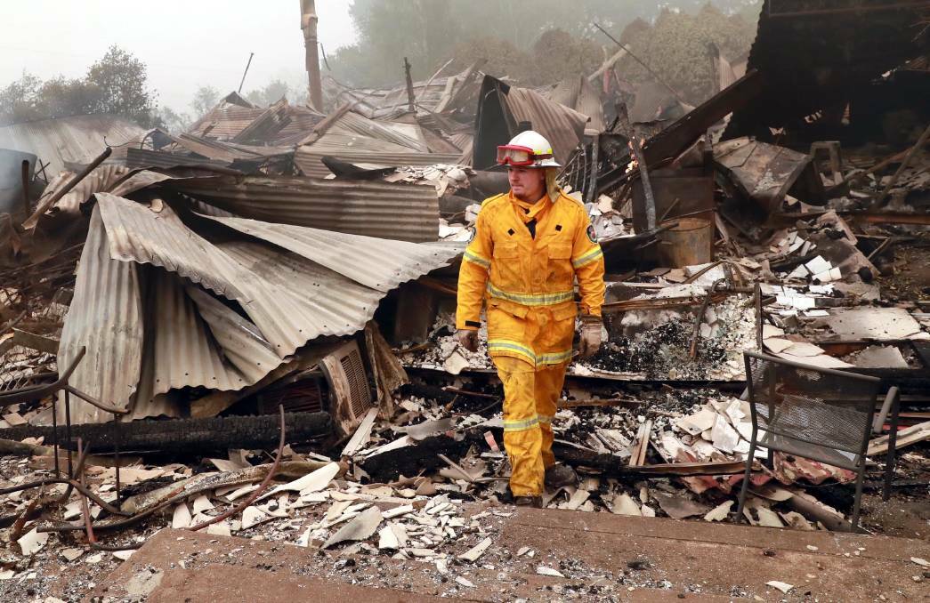 BATLOW FIRE: Chris Gibson with the Dareton fire brigade at the site of the old hospital in Batlow. Picture: Les Smith