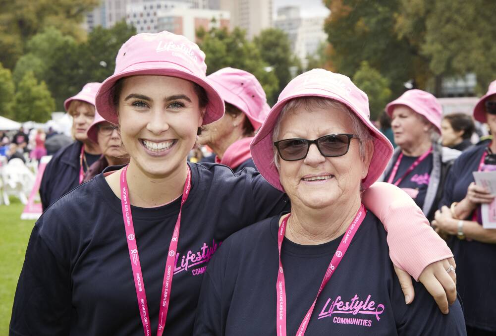PINK LADIES: Lifestyle Communities wellness program manager Olivia Macmillan with breast cancer survivor Kay Taylor at the Mother's Day Classic in Melbourne.