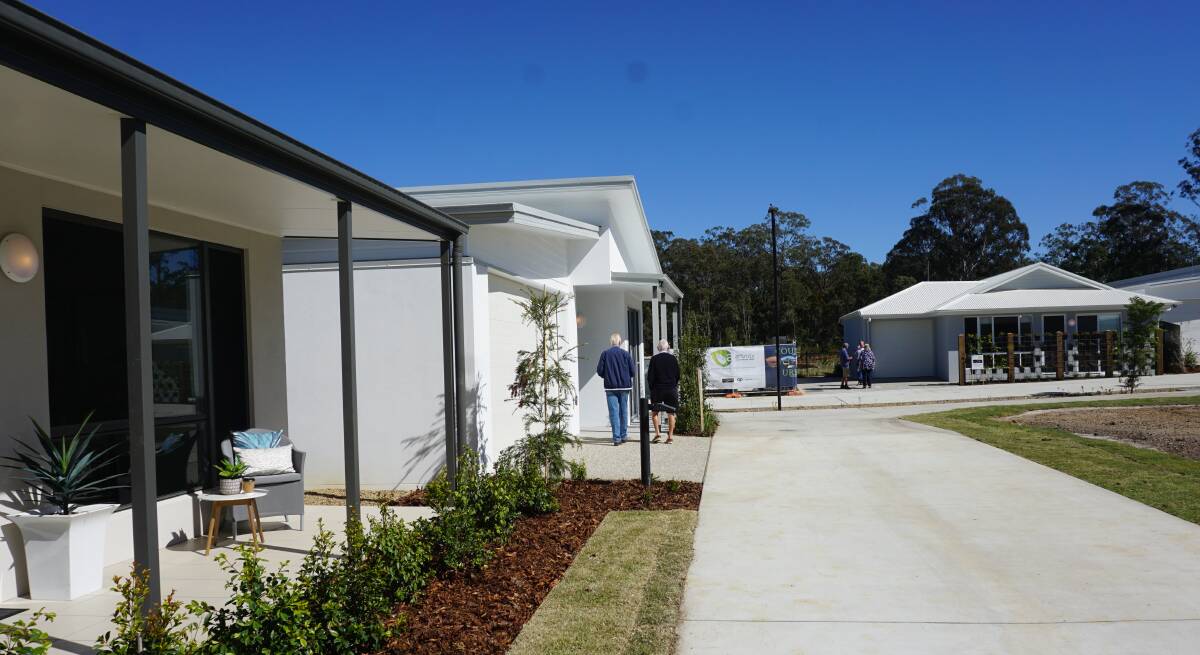 Visitors tour stage one of Sheep Station Creek retirement community in Queensland.