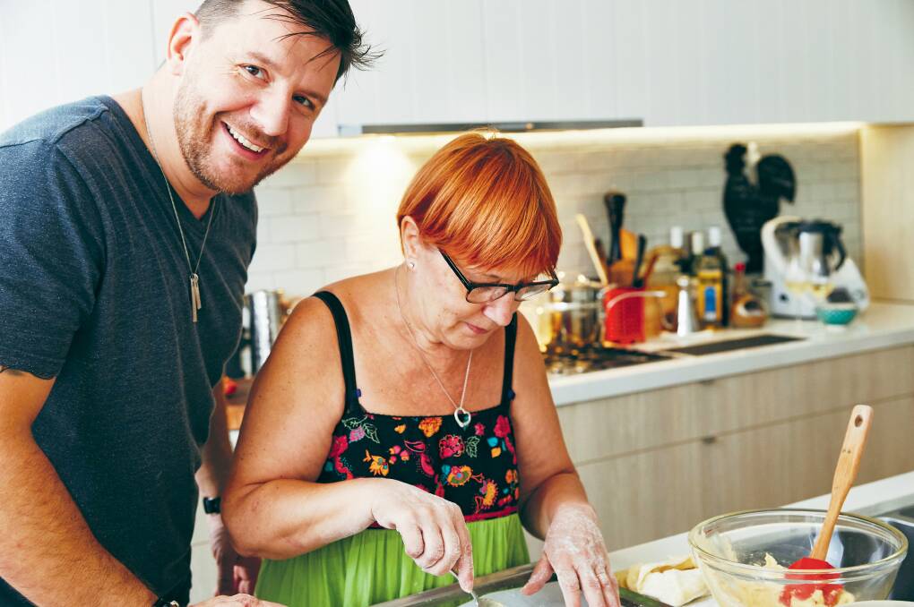 Chef Manu Feildel with his mum, breast cancer survivor Evelyne, in the kitchen.