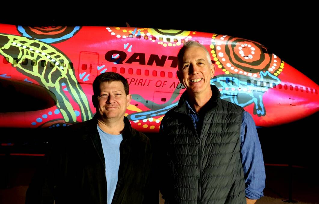 LIGHTING UP THE SKY: Buchan senior associate Anthony Rawson (left) with Qantas Founders Museum CEO Tony Martin.
