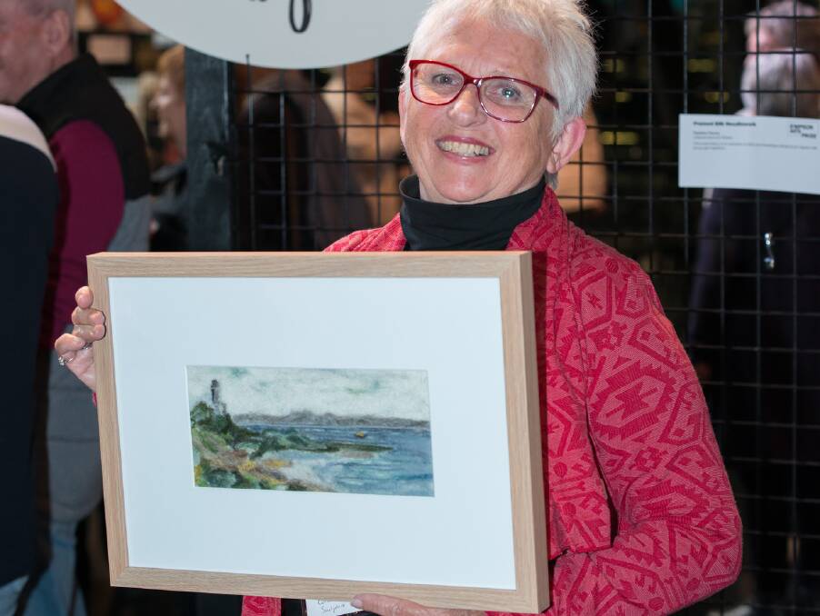 FROM THE ART: People's Choice winner Kay Hennessy from Lifestyle Ocean Grove with one of her winning artworks. Photo: Sharon Walker