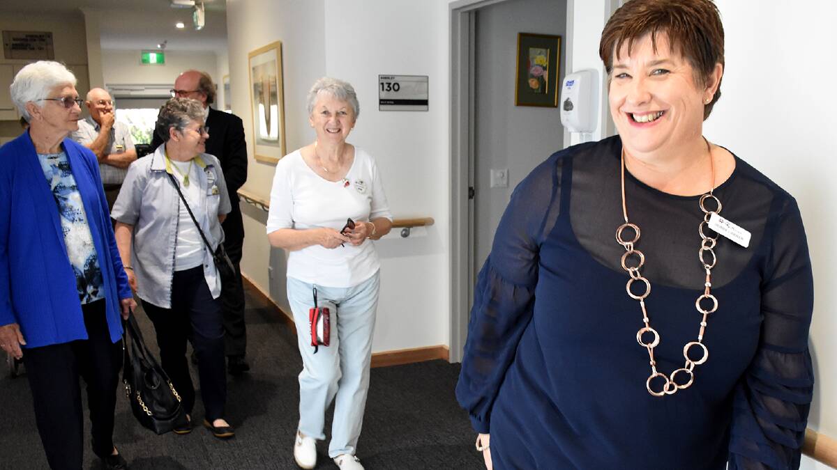 GRAND TOUR: Resthaven’s manager of residential services Debbie Lindner leads a tour group around the renovated Murray Bridge aged care facility.