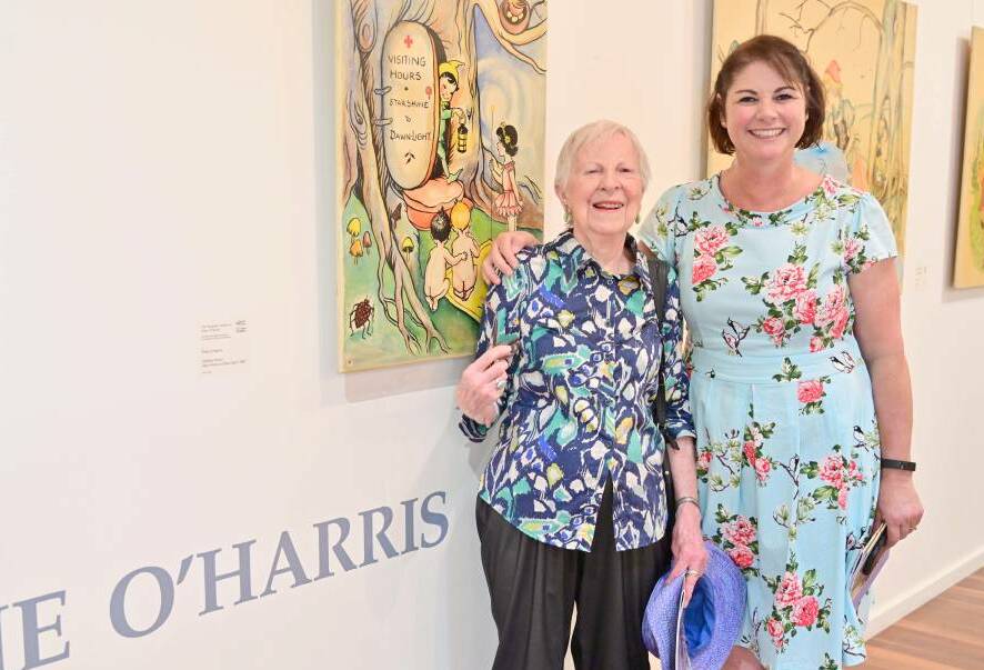 BRUSH WITH FAME: Halcyon at an exhibition of her mother Pixie O'Harris' work in Taree with Janine Roberts, who was instrumental in bringing the exhibition together. Photo: Julie Slavin