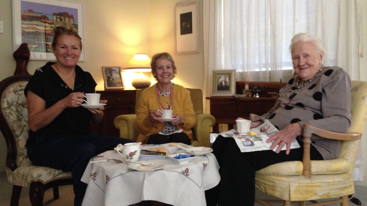 TEE-UP A TEA TIME: Meals on Wheels volunteer Chez and Lorna enjoying a morning tea, with all the trimmings, with client Dorothy.