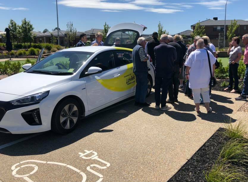 TAKING CHARGE: Homeowners at Lifestyle Berwick Waters check out the new Hyundai IONIQ Electric car and charging station. The car is free to use for all residents. 