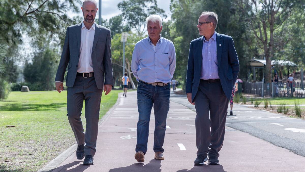 WALK THIS WAY: Sport Australia's Andrew Larratt, former Socceroo's boos Rale Rasic, and National Heart Foundation's Trevor Shilton discuss the new Walk Wise intiative at the launch.