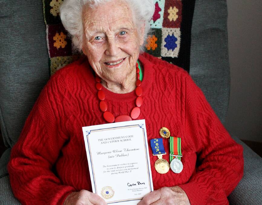 Marj Thornton, 98, with a certificate of thanks for her services during World War II. 