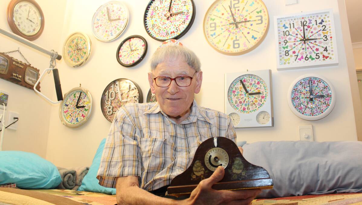 TIMELESS: Ninety-one-year-old aged care home resident Jock Findlay with his oldest clock from Scotland. He owns 76 clocks which he makes or fixes including this one he has had for 70 years.