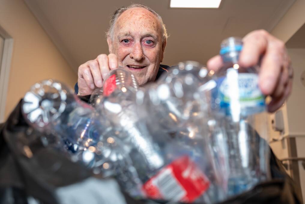 CONTAINING HIS EXCITEMENT: Des Gilbert is collecting bottles and containers to raise money for a Tovertafel projector to help people with cognitive difficulties.
