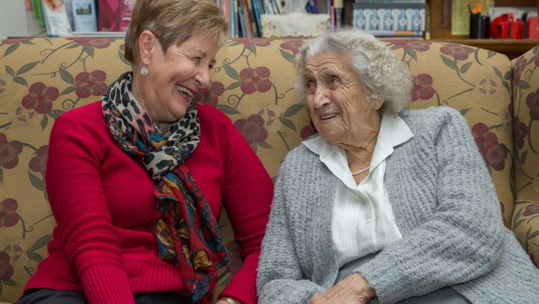 Palliative care volunteer Beryl (left) with Anam Cara House day hospice patient Muriel.
