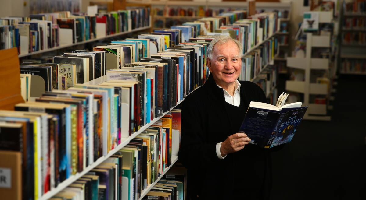 PAGE TURNER: Peter Trist loves sharing his passion for literature at his 'book chat' sessions at Newcastle Library. Photo: Newcastle Herald/Jonathan Carroll.
