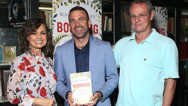 POSITIVE AGEING: Lisa Wilkinson with Marcus Riley and friend, author Larry Writer, at the Mr Riley's book launch. 